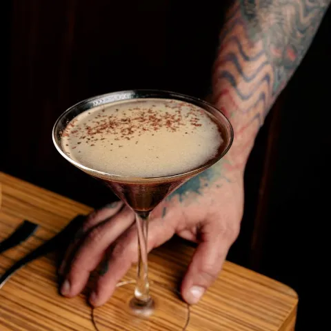 Espresso Martini being served on the table.