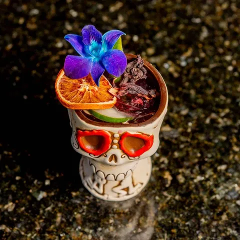 Smokey Catrina cocktail, in a skull shaped glass.