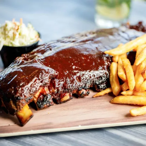 BBQ baby back ribs and fries.