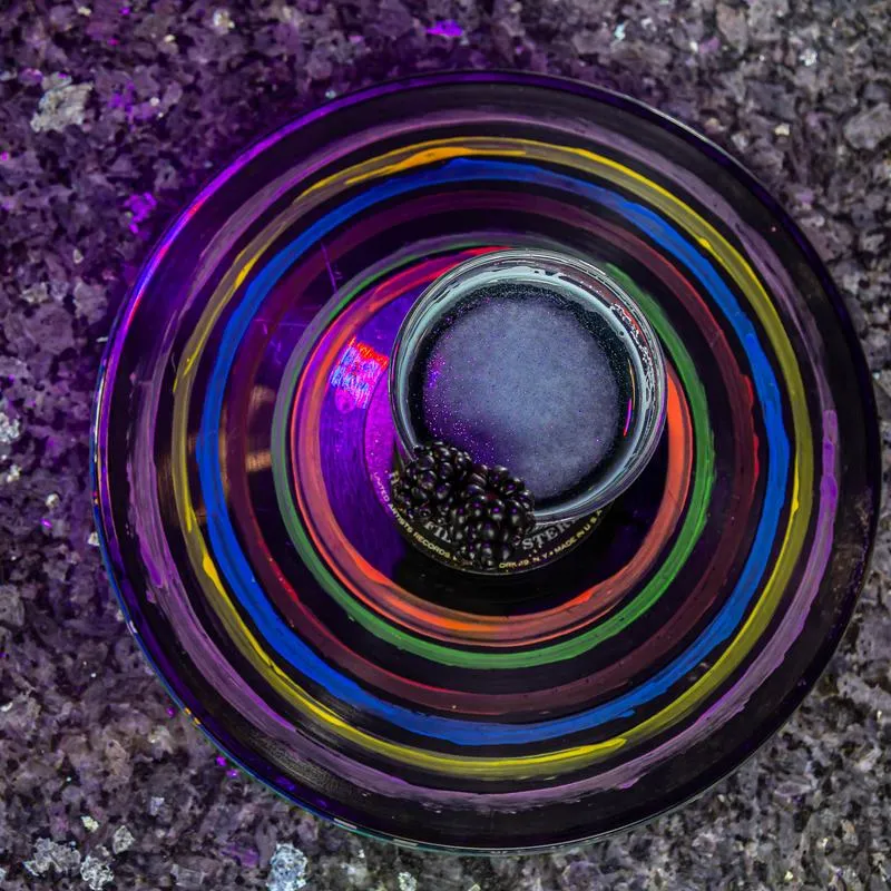 Star Dust drink on a colourful round coaster.