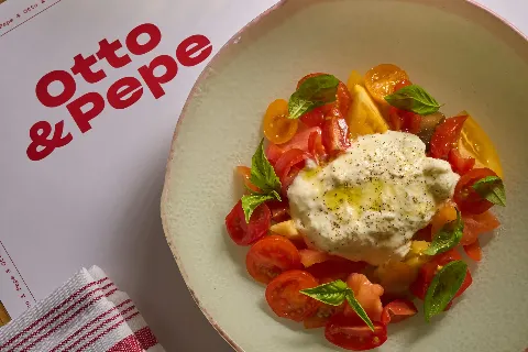 Fresh burrata with tomatoes and basil at Otto & Pepe Italian restaurant in Miami
