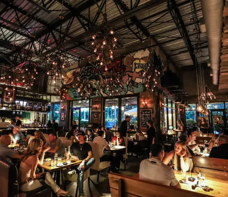Interior of Mia Kitchen & Bar at Night with Guests