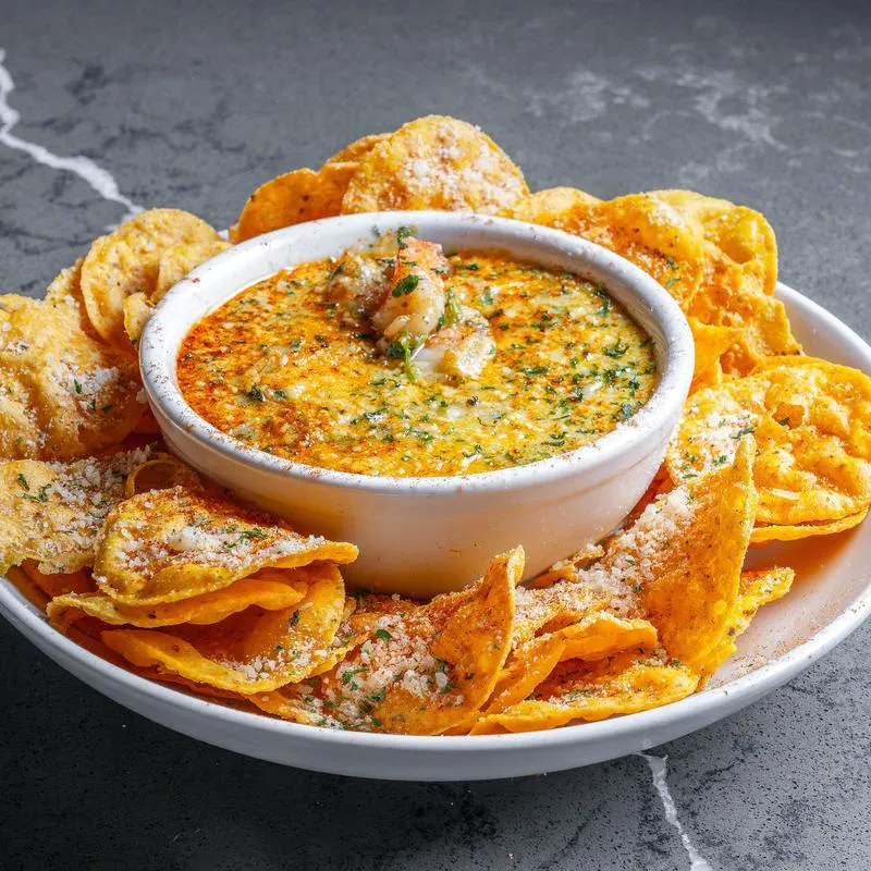 Seafood dip served with tortilla chips.