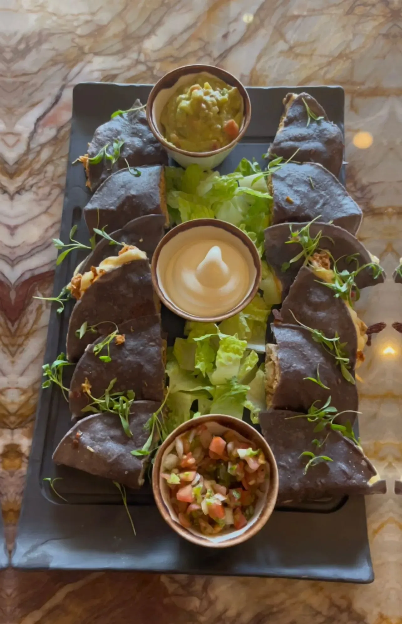 A close up of two cocktails on a bar