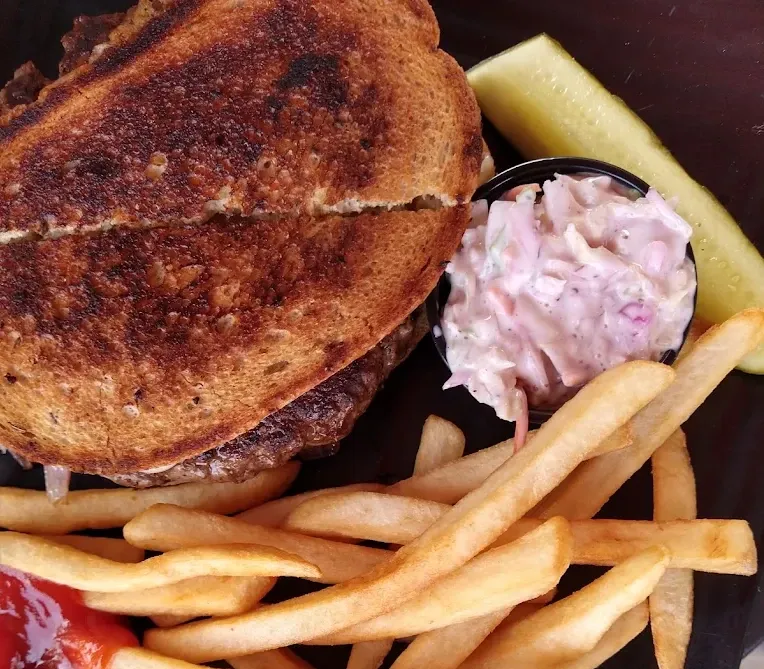 Fitzgerald's patty melt with caramelized onions and Swiss on grilled marbled rye