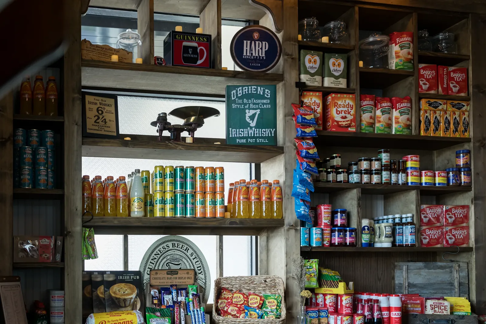 Shelves of Irish snacks, tea and drinks inside Delany's Public House.