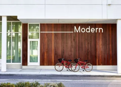 Two Bikes Parked Outside A Building