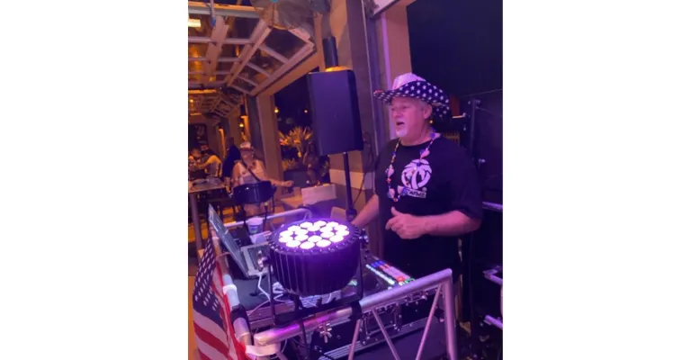 A Man Playing A Music Instrument