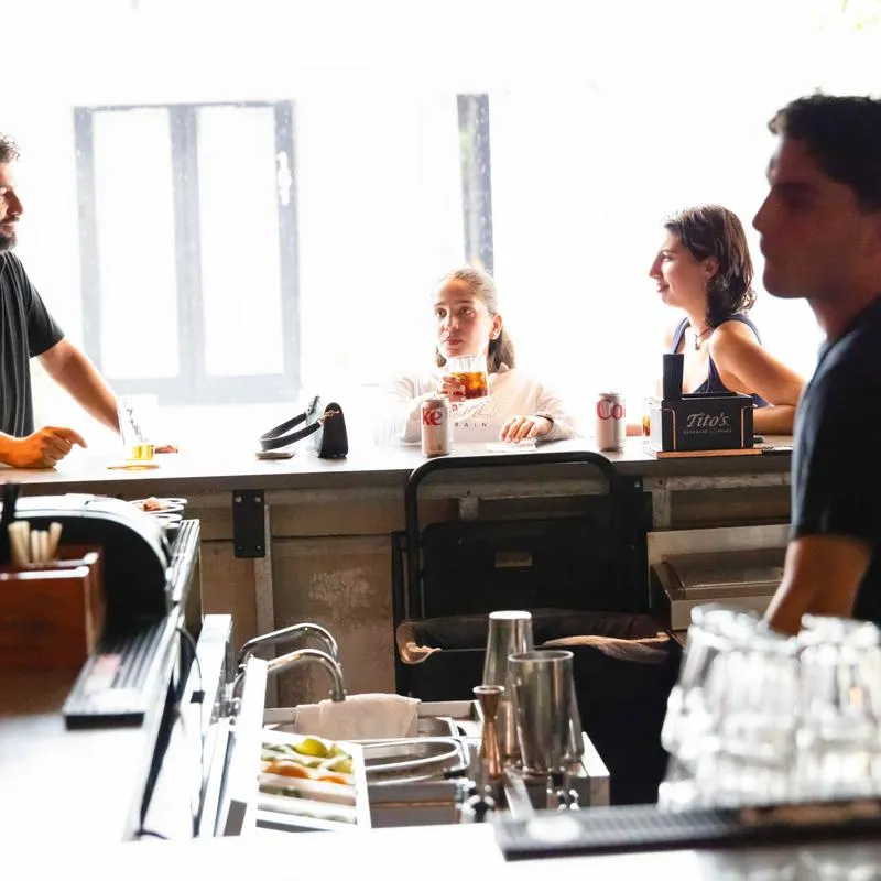 Customers sitting at the bar counter.