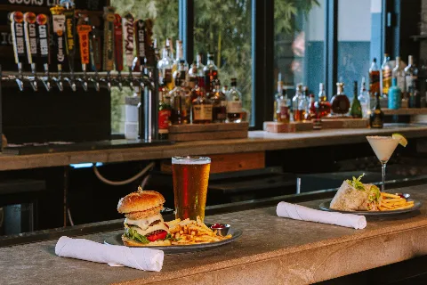 bar food with burgers beers and cocktails