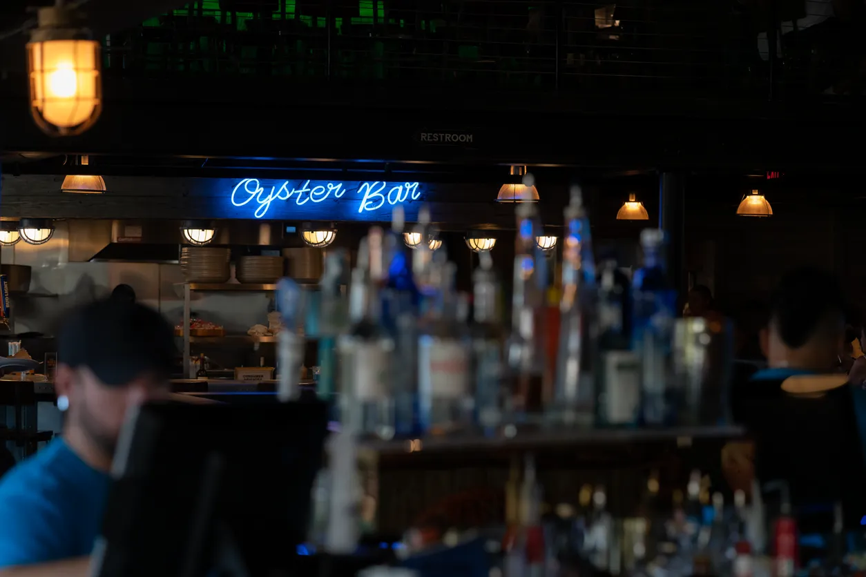 Neon Oyster Bar sign at the Wharf restaurant