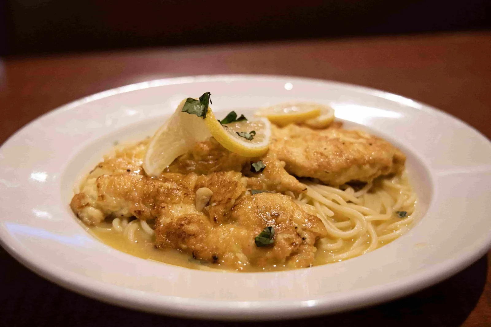 Chicken Francese with lemon over spaghetti