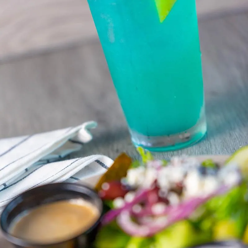 Salad, dip and blue cocktail