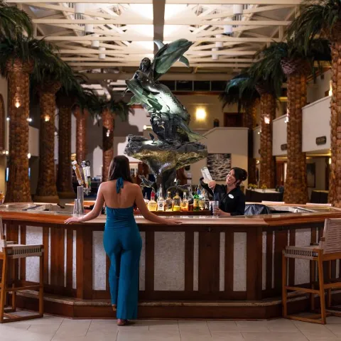 A Person Standing In Front Of A Restaurant