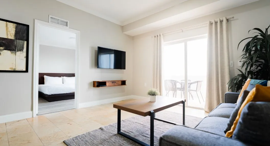 view of the master king suite living room, master bedroom and balcony