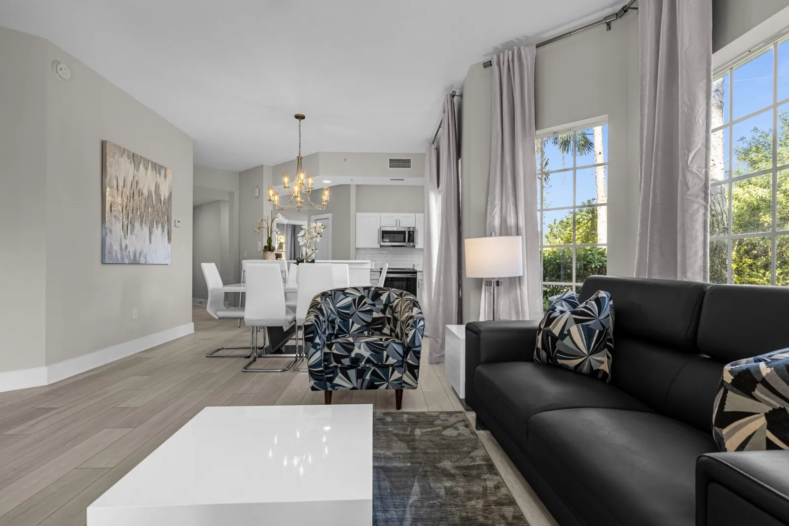 Open-plan living and dining area in a WorldQuest Orlando Resort suite