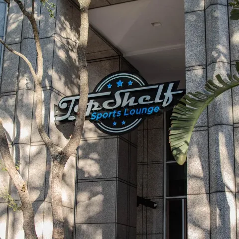 Exterior, restaurant entrance and signpost.