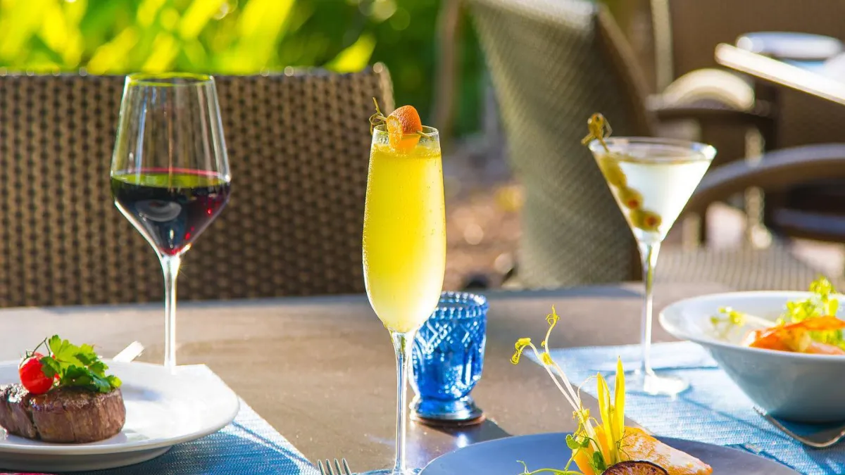 Filet mignon, red wine and Mimosa outdoor dining at Olde Florida Chop House Bonita Springs, Florida