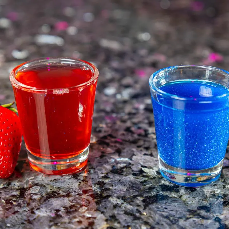 Strawberry and Blue Raz Extract Shots served on the table.