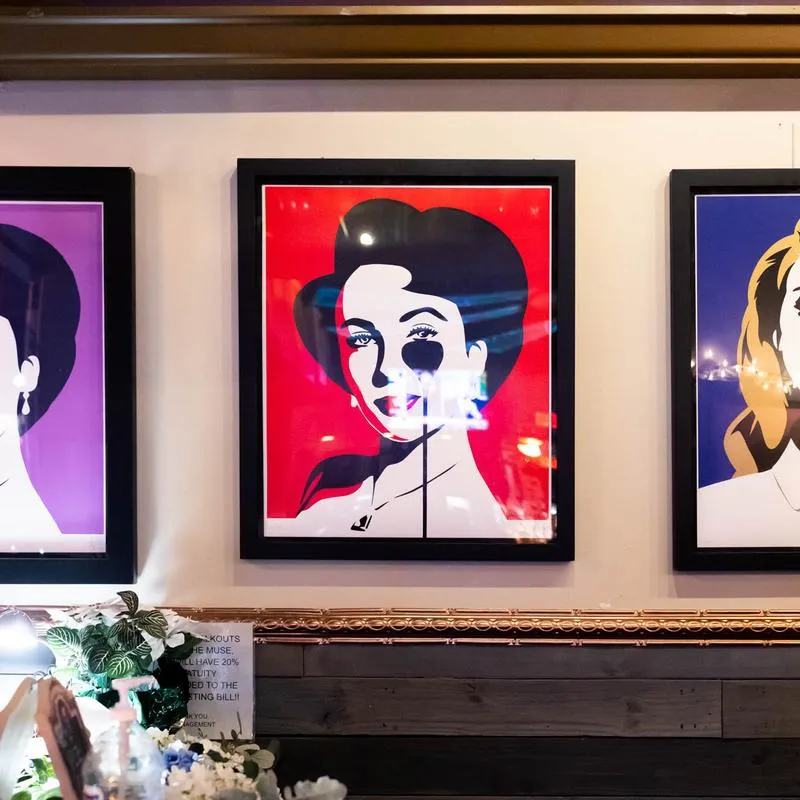 Pop Art art on a wall in seating area.