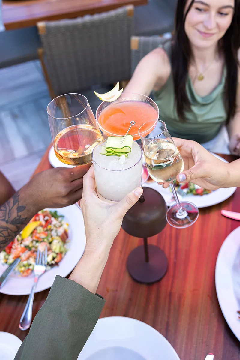 4 people having cocktails