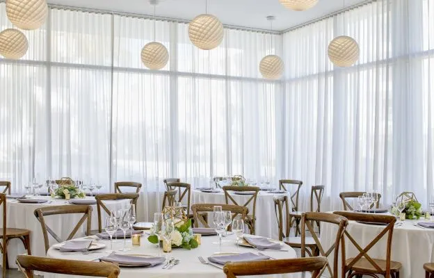 A Room With Tables And Chairs
