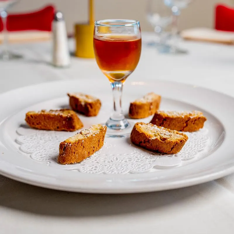 Italian biscotti cookies with a glass of Tuscan dessert wine.