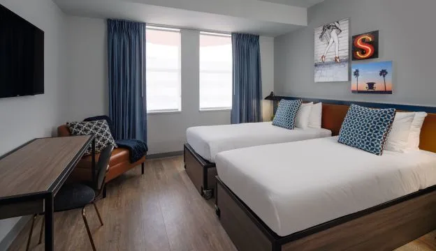 A Room With A Bed And A Table