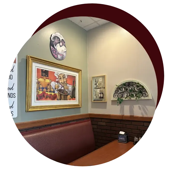 Cozy booth seating with Italian artwork
