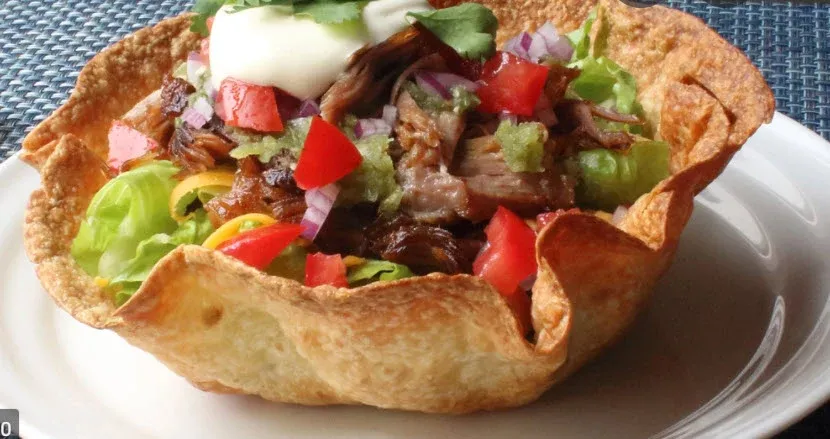 Wicked Fajita Salad Bowl (Steak)-Taco shell nestled with lettuce, pico de gallo, cheese, sour cream, guacamole, corn salsa and, house dressing. Served with well seasoned tender strips of Steak with gr