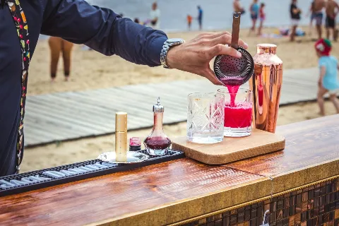 Bartender pouring cocktail