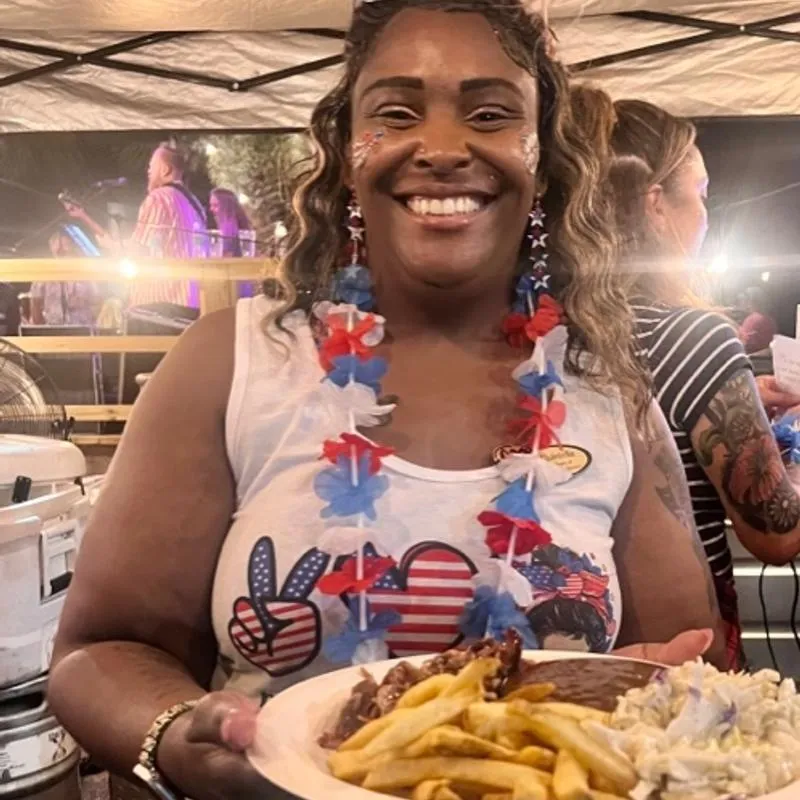 Employee serving BBQ Plate