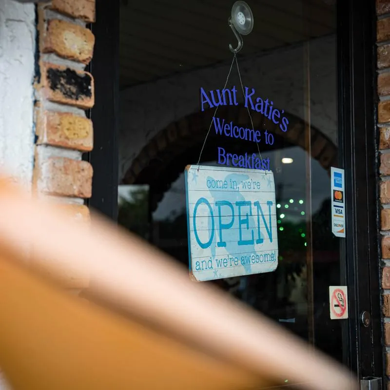 Restaurant entrance door with open sign.