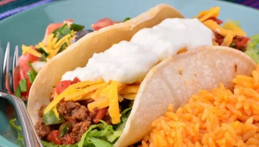 Wicked Taco Supreme (3 Steak Tacos) Taco Supreme (3 Steak Tacos). Topped with lettuce, pico de gallo, guacamole, cheese, and sour cream. Served with rice and pinto beans on the side