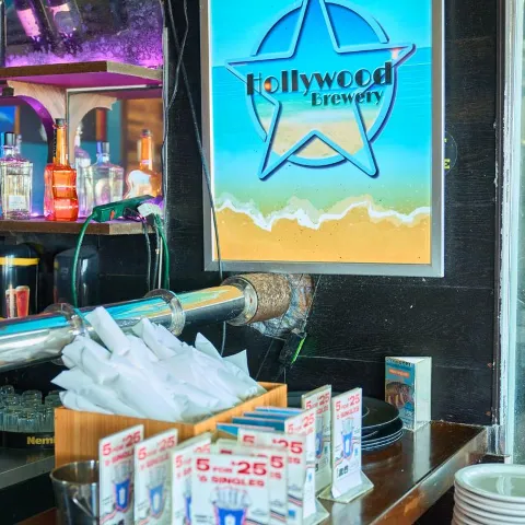 Interior counter area featuring a prominent lighted sign and various accessories.