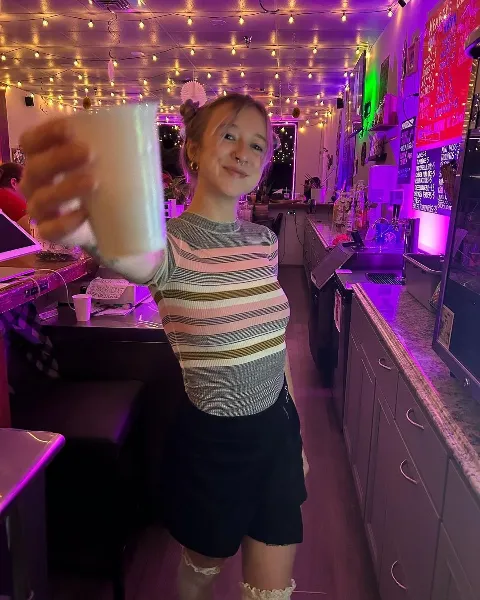 Kava Bar Employee Holding Kava Shell