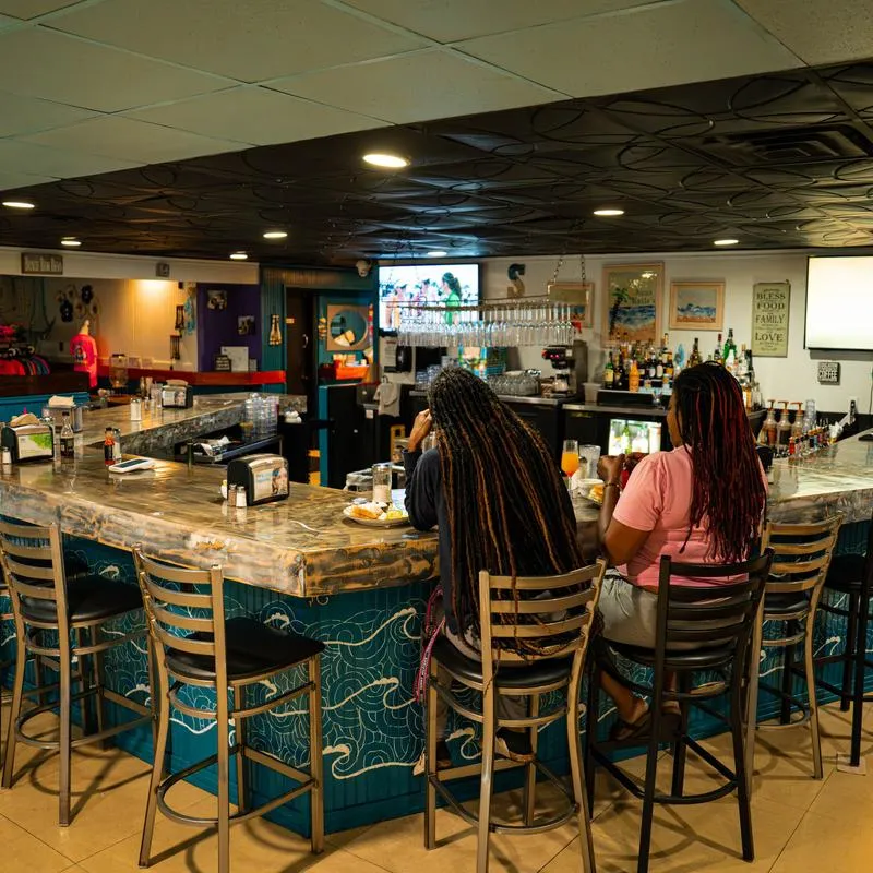 Guests sitting at the bar.
