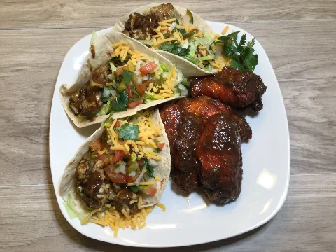 5 Jerk Wings and 3 Jerk Chicken Tacos-  Our succulent jerk wings and tender chicken tacos are seasoned with our own signature jerk spice blend, (Tacos topped with Saour cream, Pico De Gallo -Onions-To