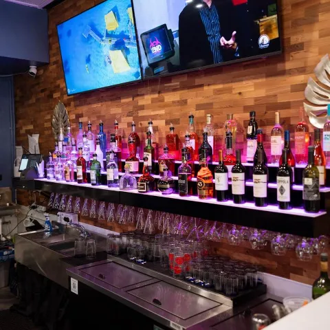 Various liquor bottles and glasses.